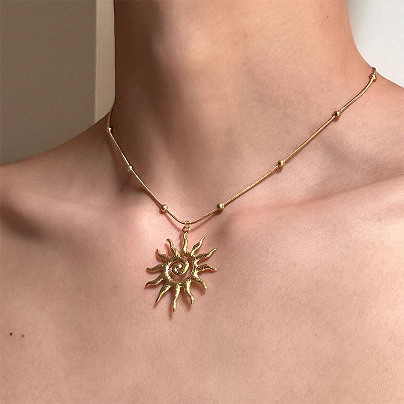 Gold tone Apollo sun pendant necklace pendant detail