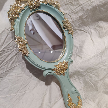 Decorative vanity mirror handle detail