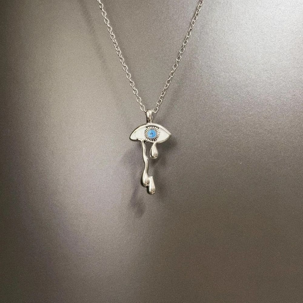 White tear eye pendant vintage silver-tone detail