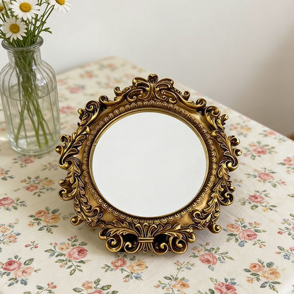 Gold-tone Baroque mirror detail