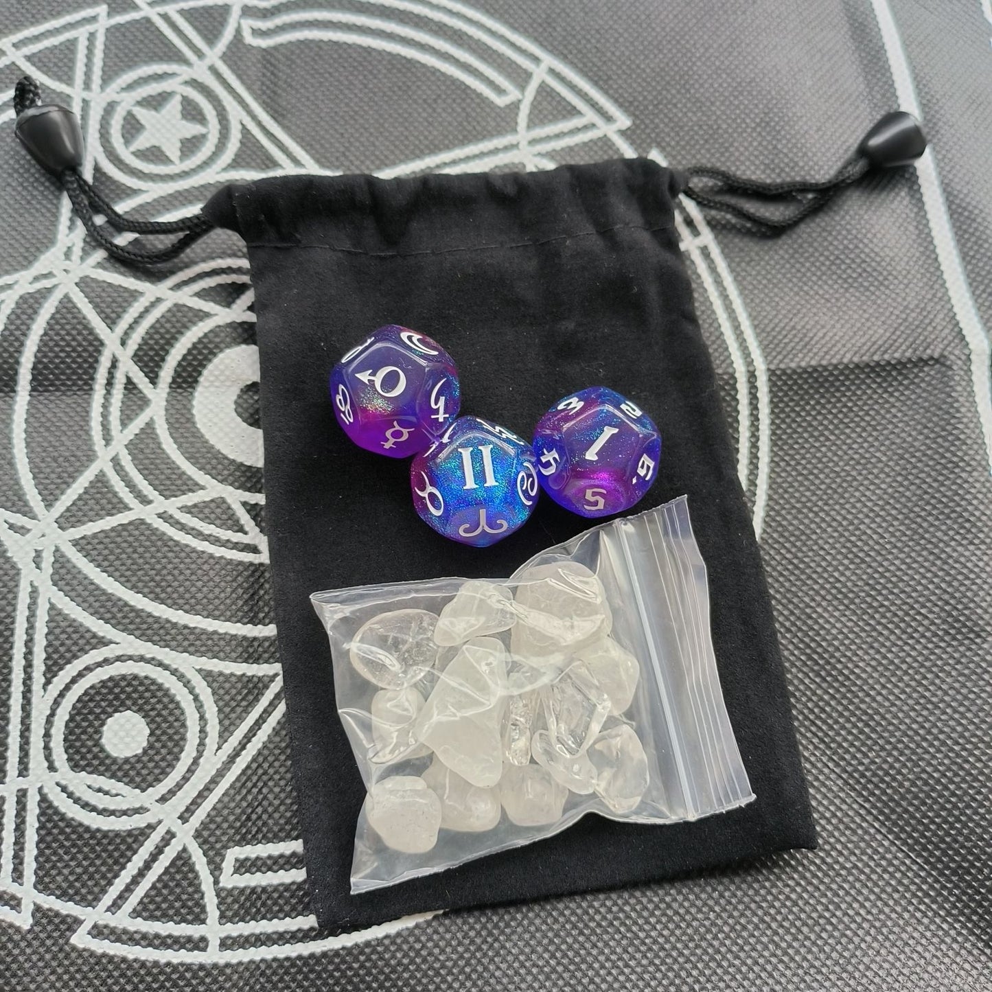 Twelve-sided zodiac and planet dice detail
